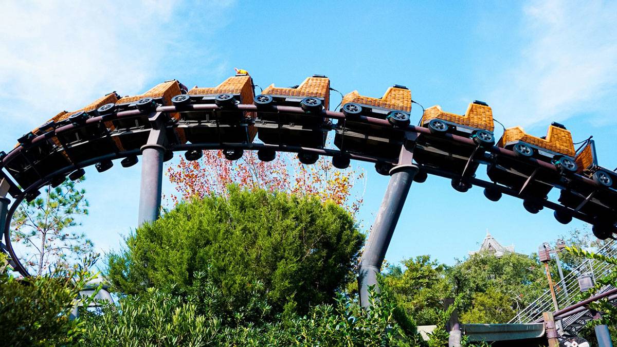 Flight of the Hippogriff Ride during daytime with blue sky and trees in Wizarding World of Harry Potter in Orlando, Florida, USA
